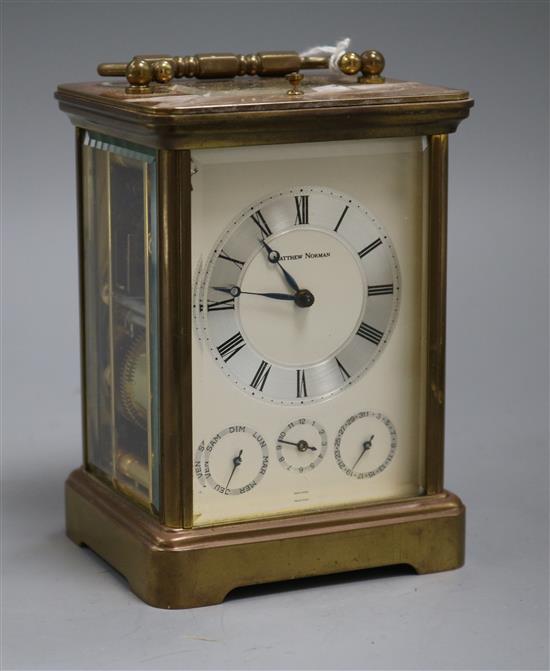 A Matthew Norman gilt brass carriage clock with calendar dials and push repeat